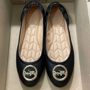 Like New Coach Bailey Black Leather Slip-On Iconic Gold Carriage Medallion Flats
